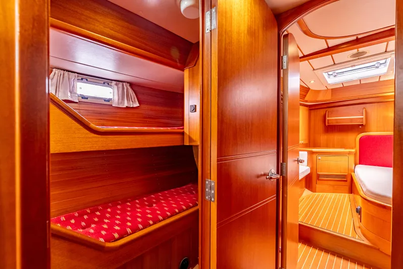 Luka Yacht Photos Pics Interior of 1997 Farr 60 Pilot House yacht with wooden finish and cozy cabin.