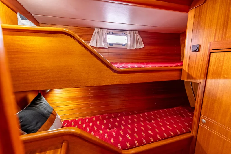 Luka Yacht Photos Pics Bunk beds in 1997 Farr 60 Pilot House yacht cabin with wooden interior.