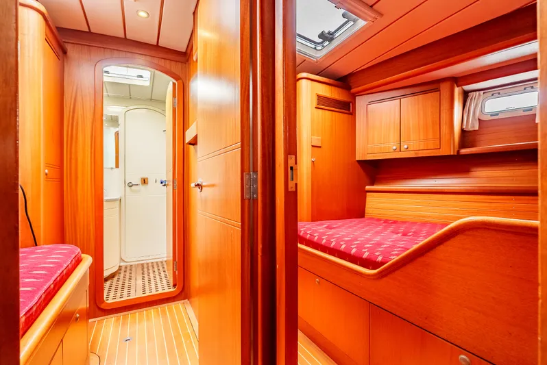Luka Yacht Photos Pics Interior of 1997 Farr 60 Pilot House yacht with wooden finish and cozy cabin.