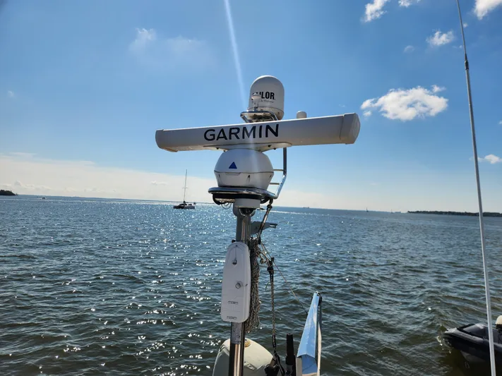 Bonnefooi Yacht Photos Pics Garmin radar on 2008 Hallberg-Rassy 62 sailboat, ocean view in background.