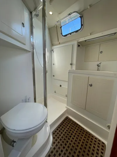 Bonnefooi Yacht Photos Pics Bathroom interior of 2008 Hallberg-Rassy 62 yacht with shower and toilet.