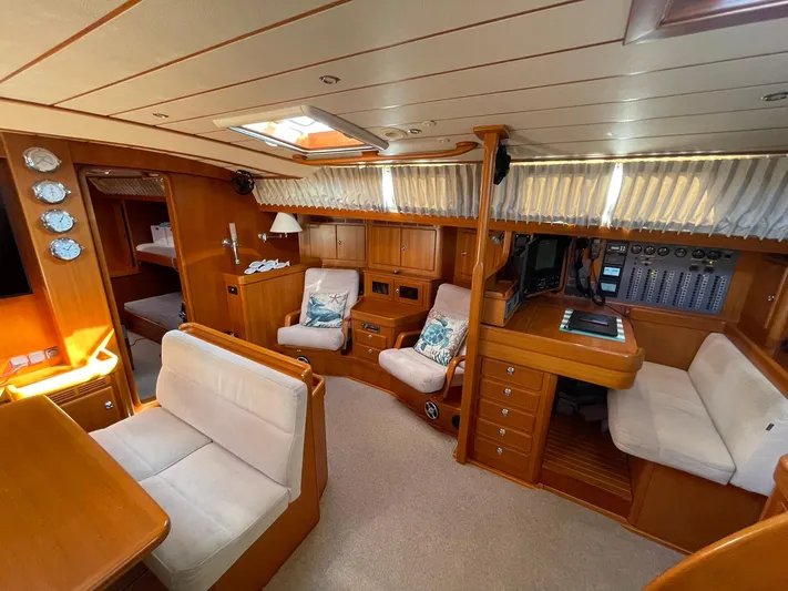 Bonnefooi Yacht Photos Pics Luxurious interior of a 2008 Hallberg-Rassy 62 yacht with elegant wood finishes.