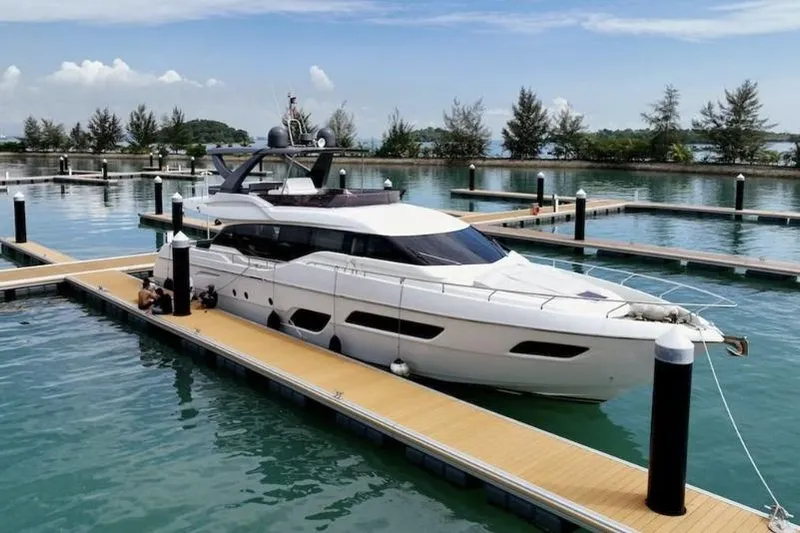  Yacht Photos Pics 2017 Ferretti Yachts 700 docked in a serene marina setting.