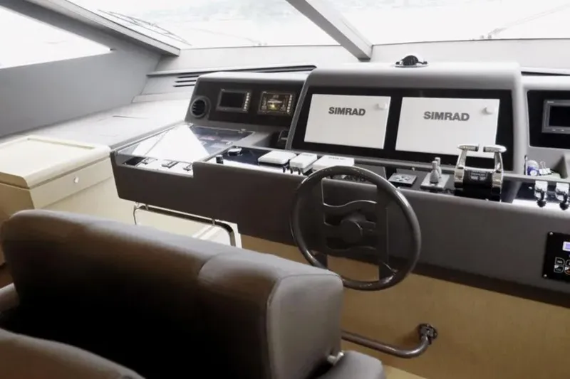  Yacht Photos Pics Cockpit of 2017 Ferretti Yachts 700 with dual Simrad displays and modern controls.