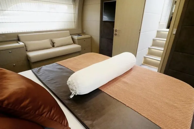 Yacht Photos Pics Luxurious bedroom interior of 2017 Ferretti Yachts 700, featuring elegant bedding and seating.