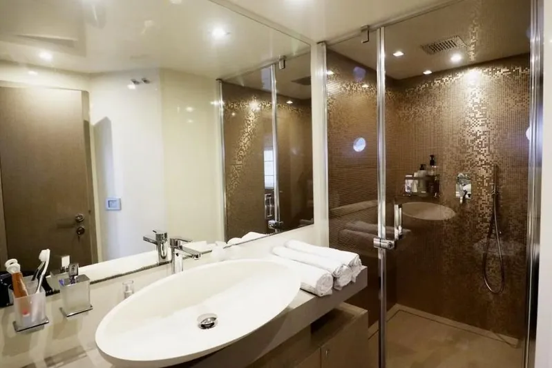  Yacht Photos Pics Luxurious bathroom in 2017 Ferretti Yachts 700, featuring elegant design and modern fixtures.