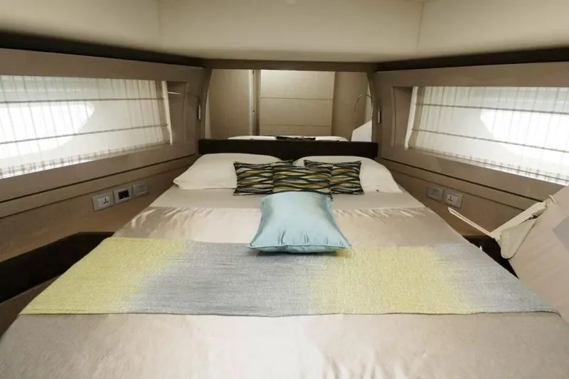  Yacht Photos Pics Luxurious bedroom interior of 2017 Ferretti Yachts 700 with elegant bedding and modern design.