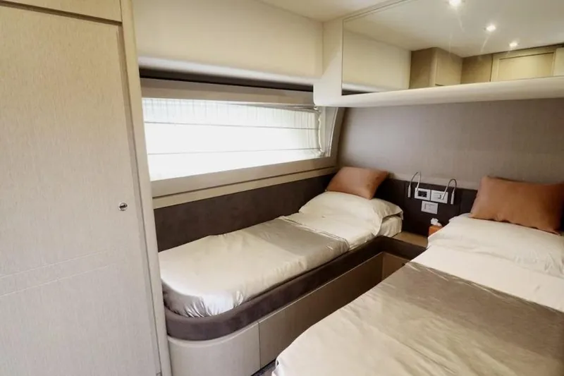  Yacht Photos Pics Luxurious twin bedroom in 2017 Ferretti Yachts 700, featuring modern design and cozy ambiance.