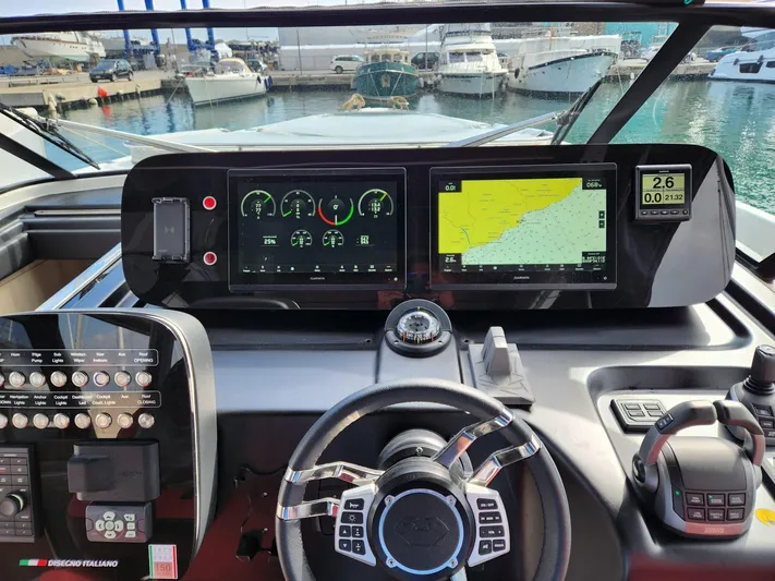  Yacht Photos Pics Dashboard of 2022 Cranchi A46 Luxury Tender with navigation and control systems.