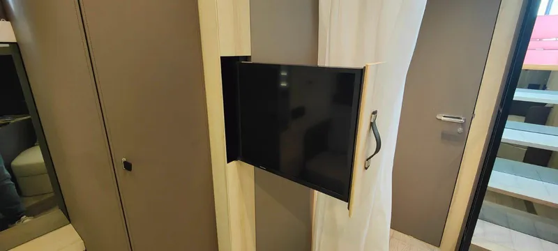  Yacht Photos Pics 2022 Cranchi A46 Luxury Tender interior with retractable TV and modern design elements.