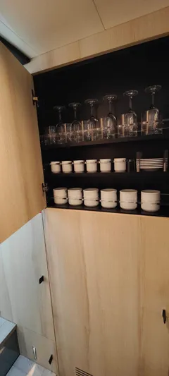  Yacht Photos Pics Cabinet with glassware and dishes inside Cranchi A46 Luxury Tender, 2022 model.