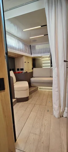  Yacht Photos Pics Interior of 2022 Cranchi A46 Luxury Tender with modern seating and wood flooring.