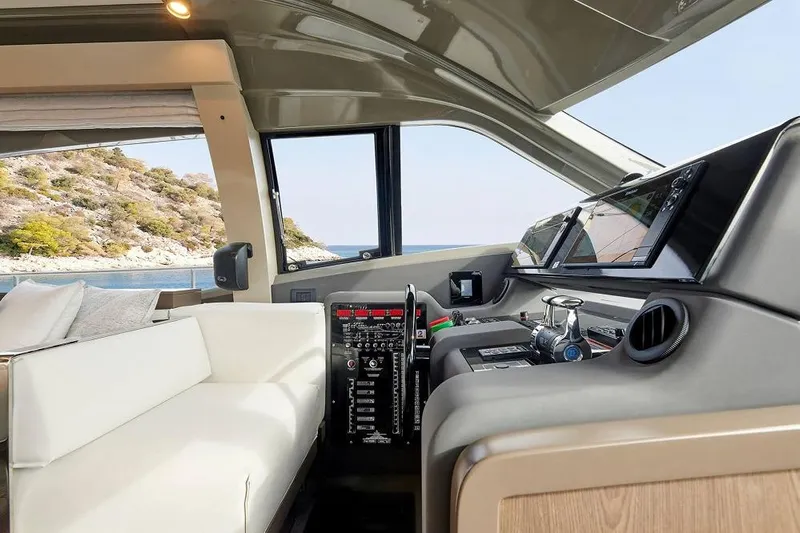  Yacht Photos Pics Interior of 2022 Ferretti Yachts 550, featuring modern helm and luxurious seating.