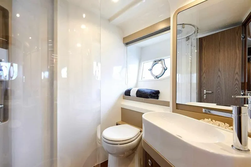  Yacht Photos Pics Luxurious bathroom in 2022 Ferretti Yachts 550, featuring modern fixtures and elegant design.
