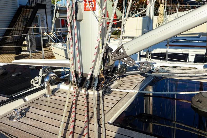  Yacht Photos Pics 2022 Hanse 388 sailboat deck with rigging and ropes in marina setting.