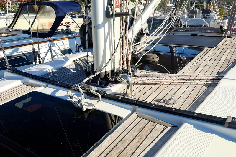  Yacht Photos Pics Deck of 2022 Hanse 388 sailboat with ropes and wooden finish.