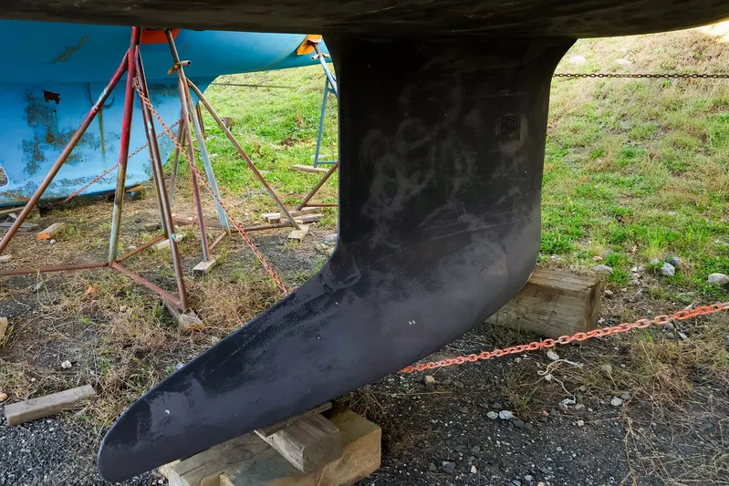  Yacht Photos Pics Keel of a 2022 Hanse 388 sailboat on dry dock, supported by stands.