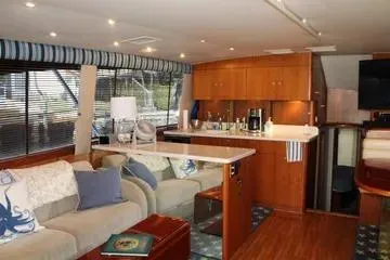 Island Dancer Yacht Photos Pics Interior of 1996 Ocean 53 Super Sport yacht with modern furnishings and kitchen area.