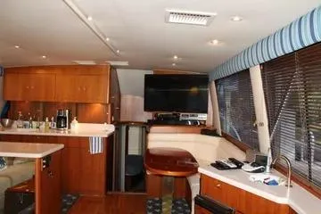 Island Dancer Yacht Photos Pics Interior of a 1996 Ocean 53 Super Sport yacht with modern amenities and wood finishes.