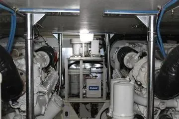 Island Dancer Yacht Photos Pics Engine room of 1996 Ocean 53 Super Sport yacht, showcasing dual engines and equipment.