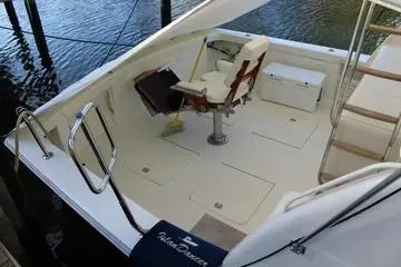 Island Dancer Yacht Photos Pics 1996 Ocean 53 Super Sport yacht deck with seating and storage.