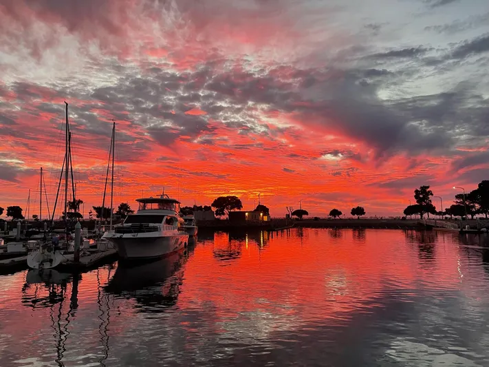 Hydrotherapy Yacht Photos Pics Sunset over marina with Jefferson 52 Rivanna Aft Cabin, 1999, reflecting on water.