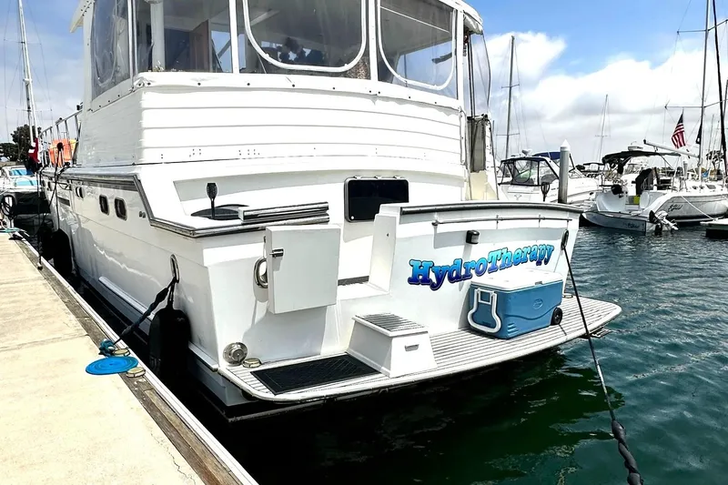 Hydrotherapy Yacht Photos Pics 1999 Jefferson 52 Rivanna Aft Cabin yacht docked, named "HydroTherapy," with cooler on deck.