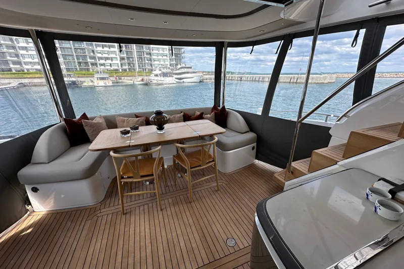  Yacht Photos Pics Luxurious 2022 Princess Y72 yacht interior with elegant seating and waterfront view.