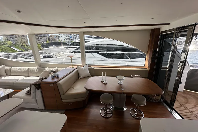  Yacht Photos Pics Luxurious interior of 2022 Princess Y72 yacht with elegant seating and dining area.