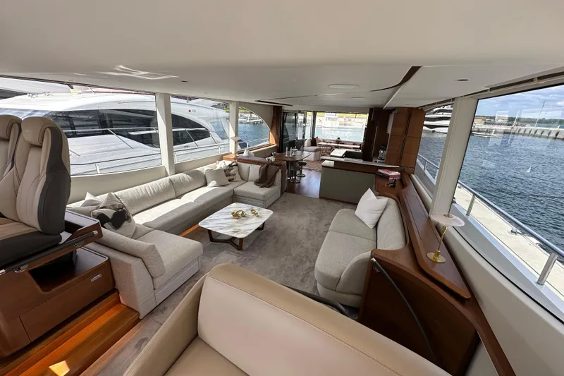  Yacht Photos Pics Luxurious interior of 2022 Princess Y72 yacht with elegant seating and waterfront view.
