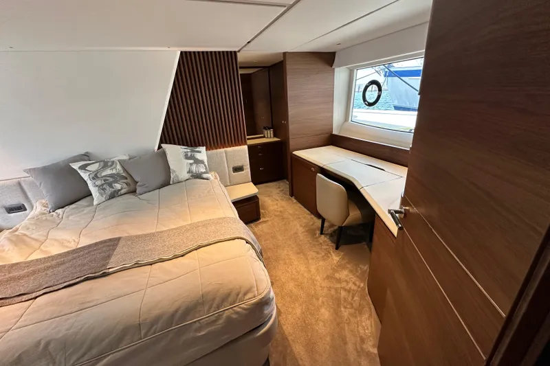  Yacht Photos Pics Luxurious 2022 Princess Y72 yacht bedroom with elegant wood finishes and modern decor.
