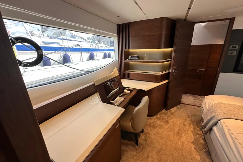  Yacht Photos Pics Luxurious interior of 2022 Princess Y72 yacht with elegant wood finishes and modern design.