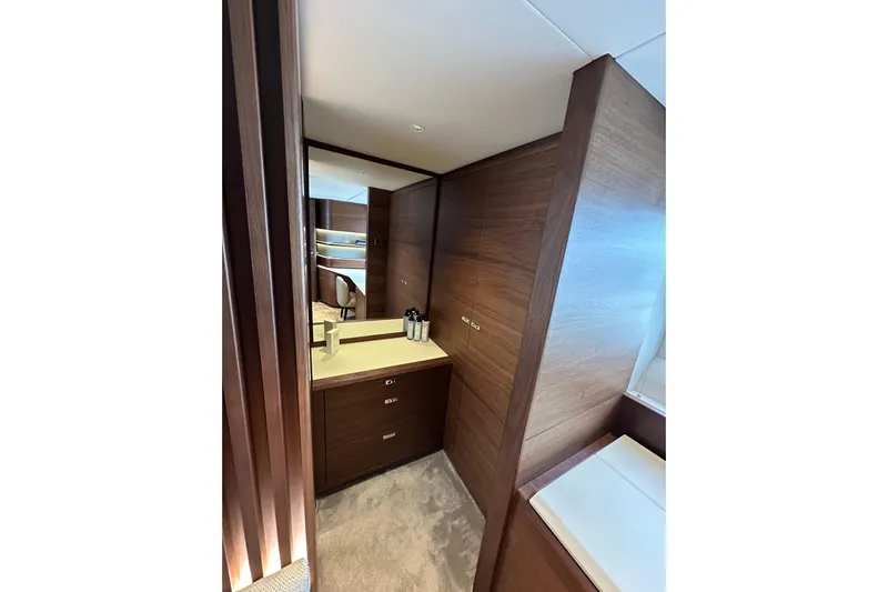  Yacht Photos Pics Luxurious interior of 2022 Princess Y72 yacht with elegant wood finish and modern design.
