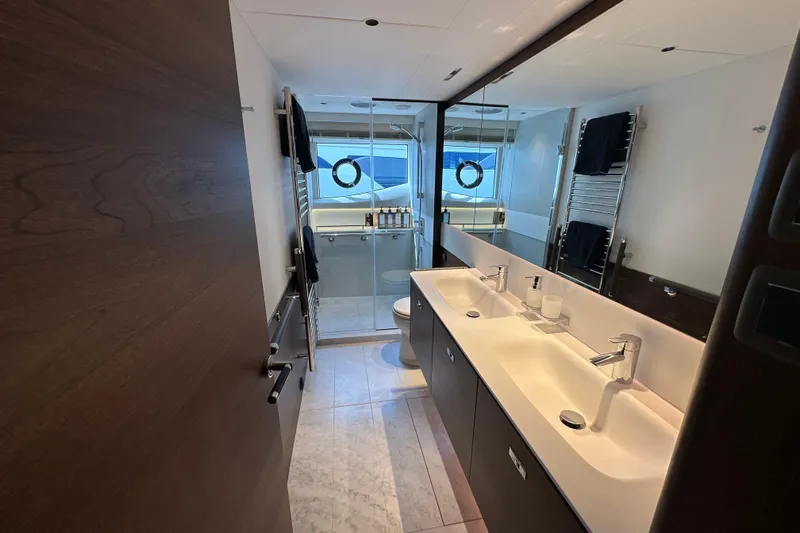  Yacht Photos Pics Luxurious bathroom interior of 2022 Princess Y72 yacht with dual sinks and modern fixtures.
