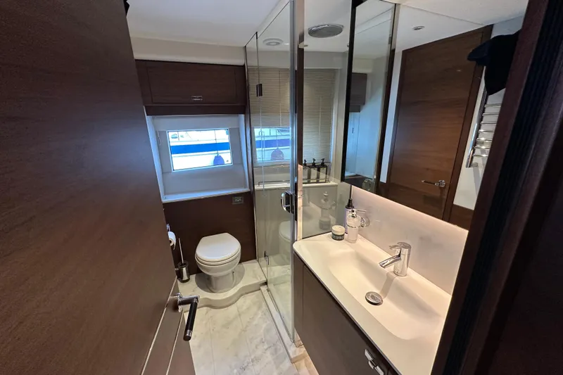  Yacht Photos Pics Luxurious bathroom in 2022 Princess Y72 yacht with modern fixtures and elegant design.
