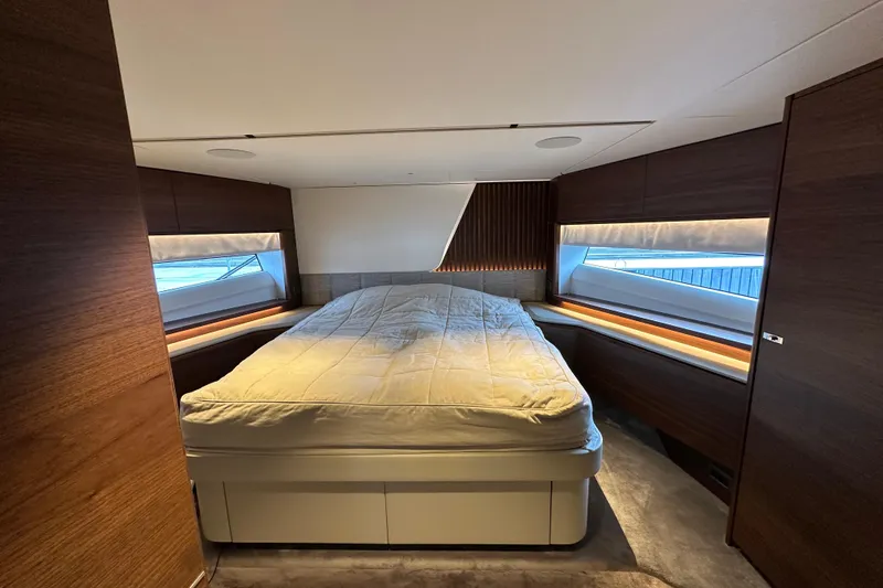  Yacht Photos Pics Luxurious bedroom interior of 2022 Princess Y72 yacht with modern design and large windows.