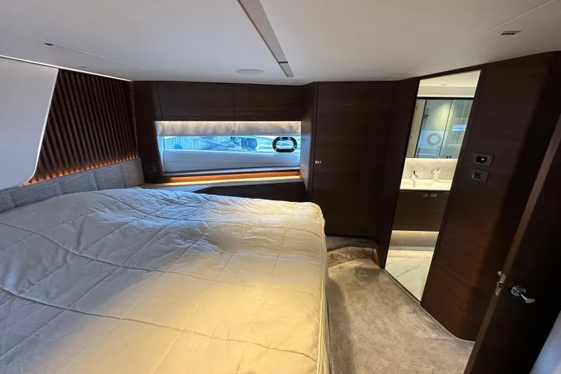  Yacht Photos Pics Luxurious 2022 Princess Y72 yacht bedroom with modern design and elegant wood finishes.