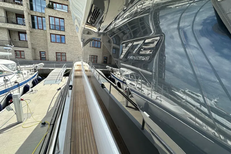  Yacht Photos Pics Luxury yacht Princess Y72, 2022 model, docked at a marina with sleek design.