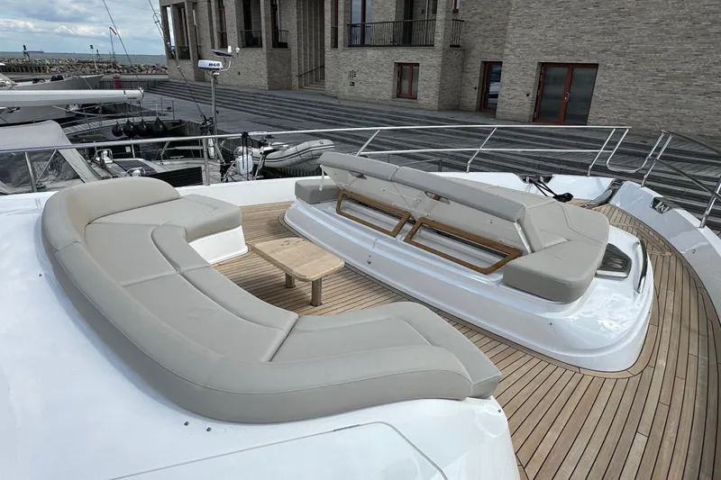  Yacht Photos Pics Luxurious 2022 Princess Y72 yacht deck with elegant seating and wooden flooring.