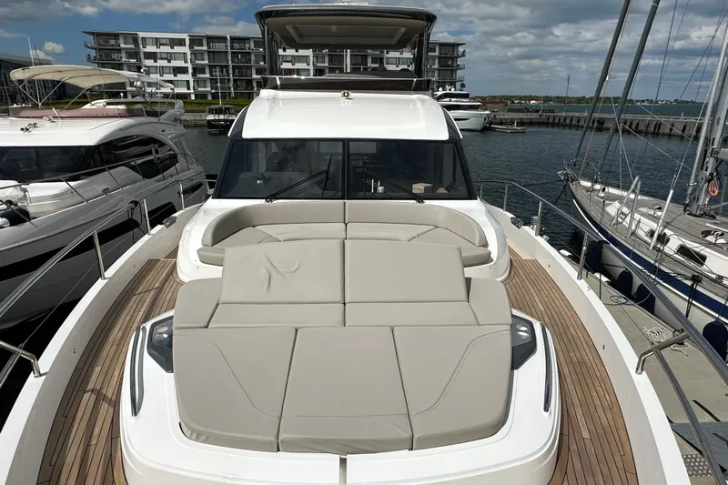  Yacht Photos Pics Luxurious 2022 Princess Y72 yacht with spacious deck and modern design, docked at marina.
