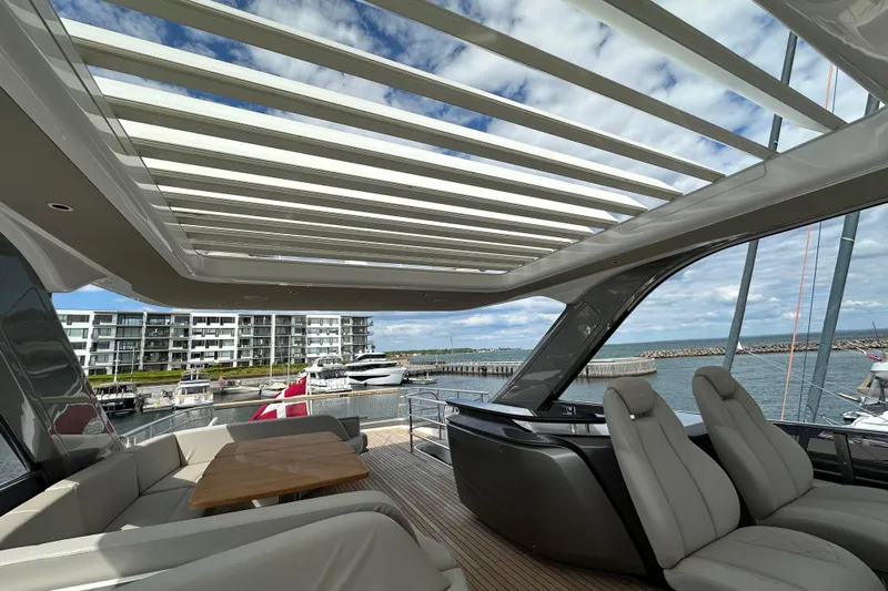  Yacht Photos Pics Luxurious 2022 Princess Y72 yacht interior with modern seating and open roof design.