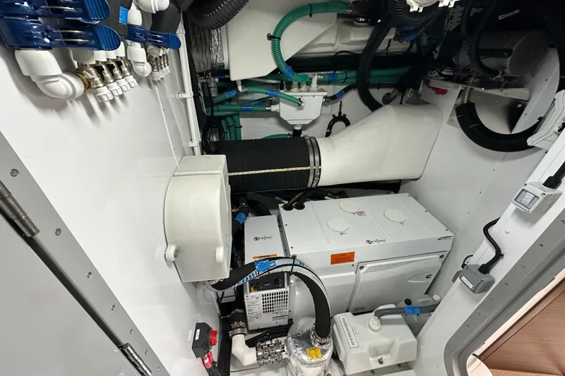  Yacht Photos Pics Engine room of 2022 Princess Y72 yacht with mechanical components and piping.