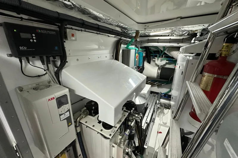 Yacht Photos Pics Engine room of 2022 Princess Y72 yacht, featuring control units and safety equipment.