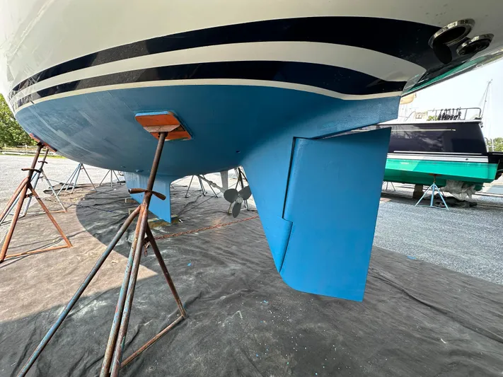 Elusive Yacht Photos Pics Hinckley Sou'wester 42 sailboat hull and rudder, 1987 model, on stands for maintenance.
