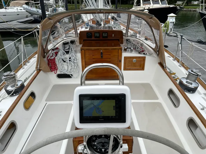 Elusive Yacht Photos Pics Cockpit of 1987 Hinckley Sou'wester 42 sailboat with navigation equipment and ropes.