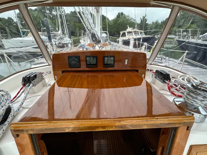 Elusive Yacht Photos Pics Hinckley Sou'wester 42 cockpit view, showcasing polished wood and navigation instruments, 1987 model.