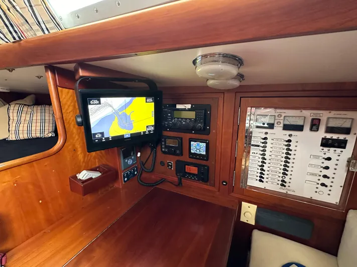 Elusive Yacht Photos Pics Hinckley Sou'wester 42 yacht interior, 1987 model, featuring navigation equipment and control panel.