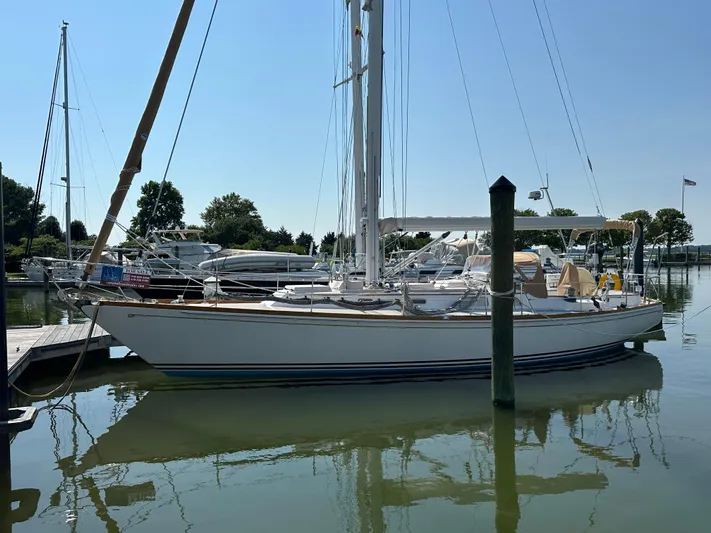 Elusive Yacht Photos Pics 1987 Hinckley Sou'wester 42 sailboat docked in a marina on a sunny day.