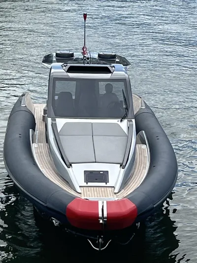 Freebird 42 Yacht Photos Pics 2022 Anvera 42 boat on water, sleek design, black and red accents, modern cabin.