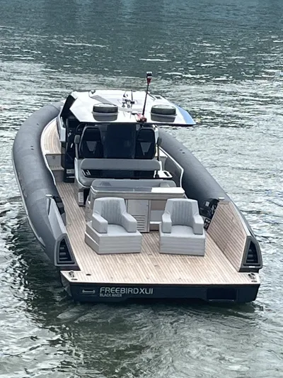 Freebird 42 Yacht Photos Pics 2022 Anvera 42 luxury boat on water, featuring sleek design and spacious deck seating.